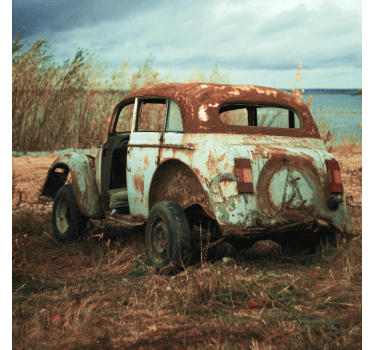 Living room poster of a weathered car in the fields - TenStickers