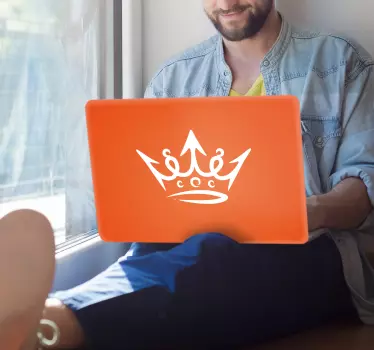 Laptop skin with crown symbol accent - TenStickers