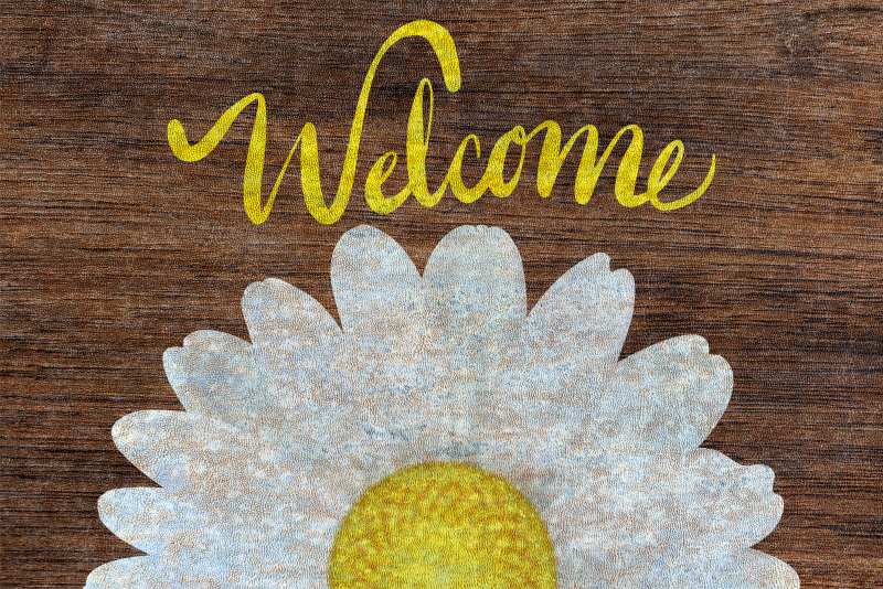 Daisy welcome message entrance hall rug - TenStickers